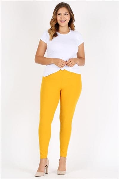 Stylish Beautiful Young Blond Woman in a Tight Yellow Pants, Black Top and  White Shirt Near a White Wall in the Room. Attractive Stock Photo - Image  of caucasian, fitness: 198837630